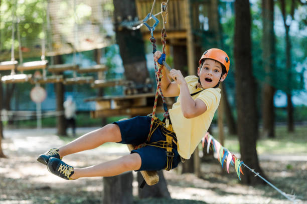 istock surprised kid in helmet riding in adventure park 1179612511