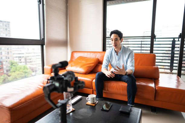 istock Mixed race man vlogging at home 1179612720