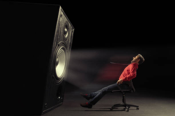 Powerful sound wave. The sound wave set back an chair with screaming man. subwoofer photos stock pictures, royalty-free photos & images