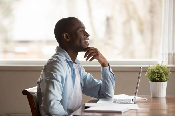 istock Happy young african american guy visualizing future, weekend or vacation time. 1179614170