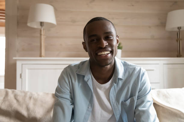 istock Smiling mixed race young man holding video conference call. 1179614227