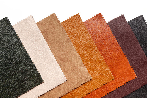 Samples of natural, textured, multi-colored leather. Top view