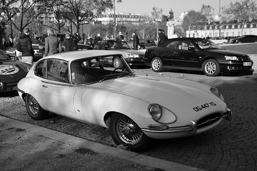 Paris, France - November 18th 2018 : Jaguar e-type 4.2 (probably a series 1)  parked in the street in front of Army museum. Each sunday, an association of cars organise an exhibition in the quarter. View of the front of the car.