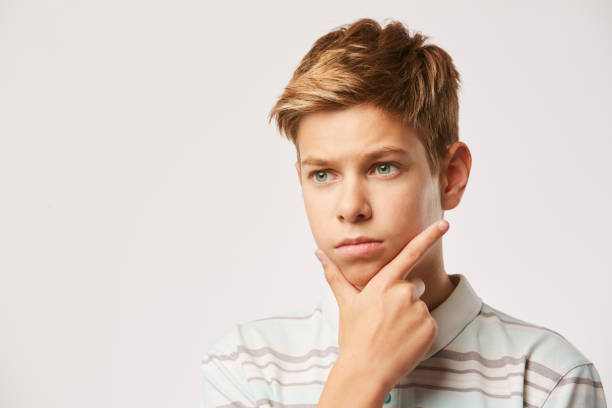 istock Portrait of pensive boy 1179617212