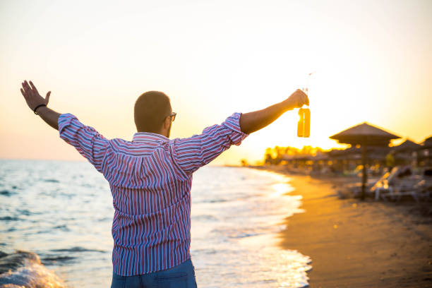 Happy carefree man on the beach