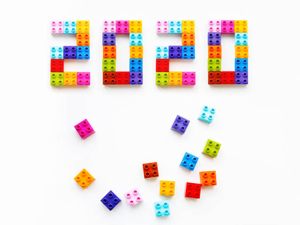 istock New 2020 Year. Colorful constructor blocks. Toy bricks lying without order. Copy space among multicolored toy details. 1179618633