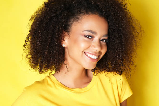 istock Beautiful smile from young happy model isolated on yellow background. 1179618691