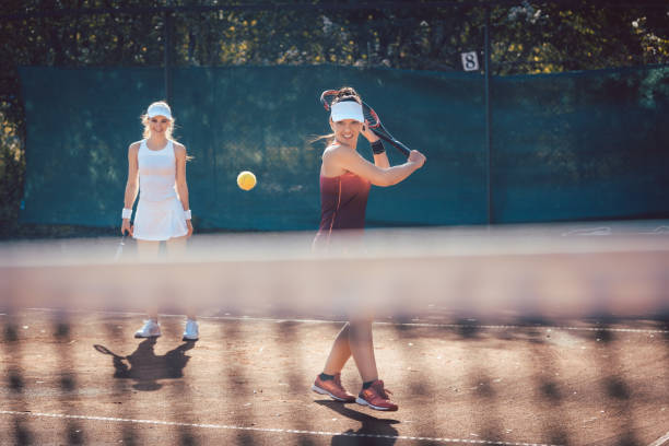 istock Woman in a tennis double 1179620125