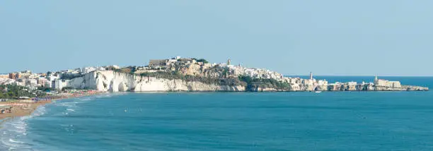 Panorama of Vieste and Pizzomunno beach view in a summer day, Gargano peninsula, Apulia, southern Italy, Europe.