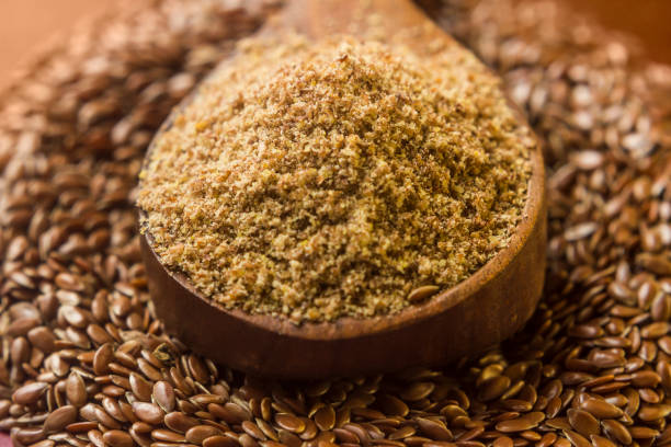 istock Ground, crushed, milled flaxseed, linseed in wooden spoon 1179620386