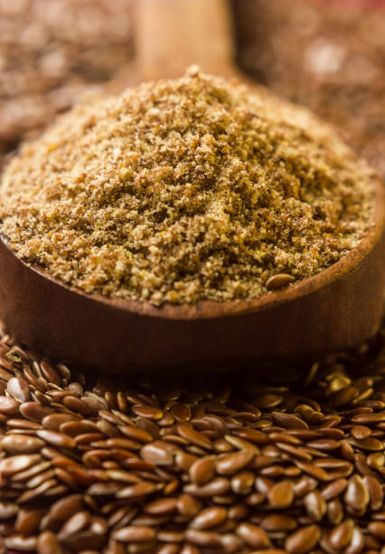 istock Ground, crushed, milled flaxseed, linseed in wooden spoon 1179620477