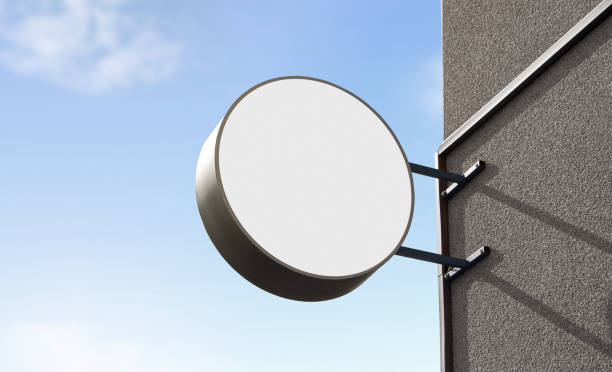 istock Blank white outdoor round box mockup wall mounted, sky background 1179620480