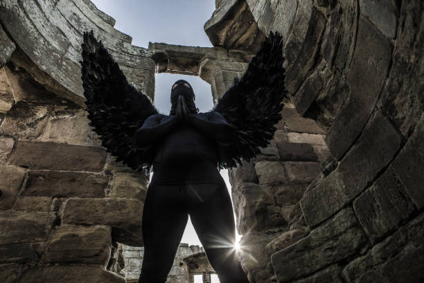 istock Black Winged Warrior Angel in an abandoned castle 1179620538