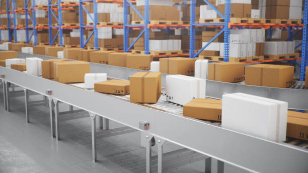 istock Packages delivery, parcels transportation system concept, cardboard boxes on conveyor belt in warehouse. Warehouse with cardboard boxes inside on pallets racks. Huge modern warehouse, 3D Illustration 1179621822