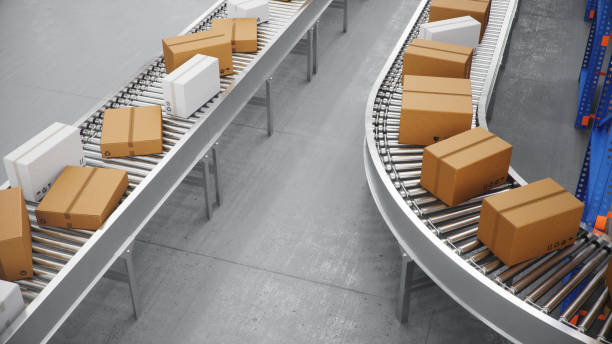 istock Packages delivery, parcels transportation system concept, cardboard boxes on conveyor belt in warehouse. Warehouse with cardboard boxes inside on pallets racks. Huge modern warehouse, 3D Illustration 1179621836