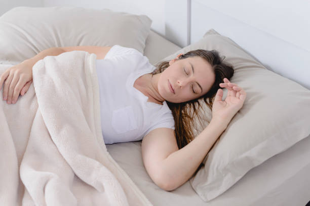 istock Beautiful woman sleeping in her bed 1179622457