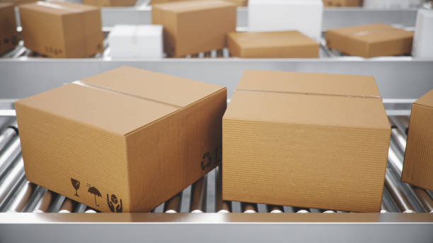 istock 3D illustration Packages delivery, packaging service and parcels transportation system concept, cardboard boxes on a conveyor belt in a warehouse, Three conveyor belts 1179622594