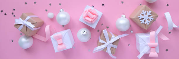 istock Christmas background with decorations and gift boxes on pink background 1179622804