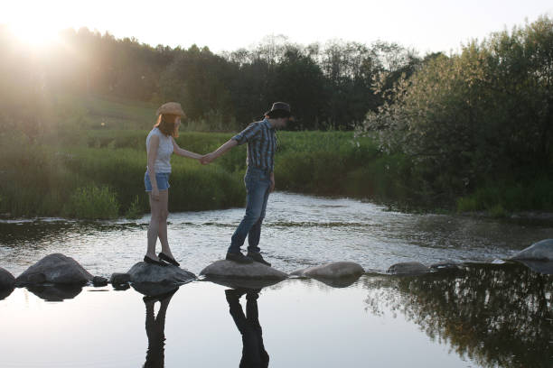 istock Cute couple on a walk by the countryside 1179623028