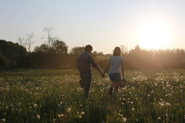 istock Cute couple on a walk by the countryside 1179623124