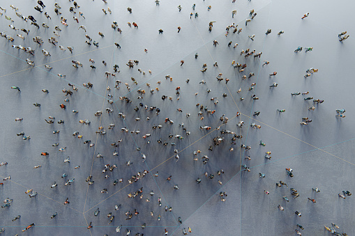 Urban crowds of people from above. This is entirely 3D generated image.