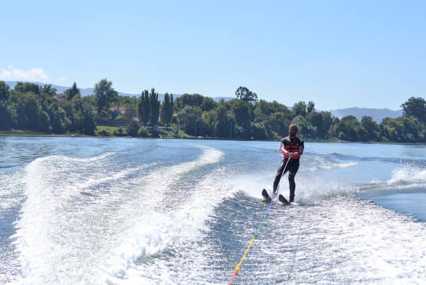 istock Young man waterskiing over the Minho river 1179625907