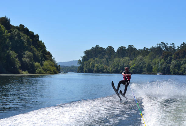 istock Young man waterskiing over the Minho river 1179626131