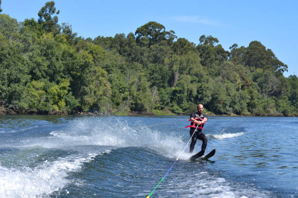 istock Young man waterskiing over the Minho river 1179626231