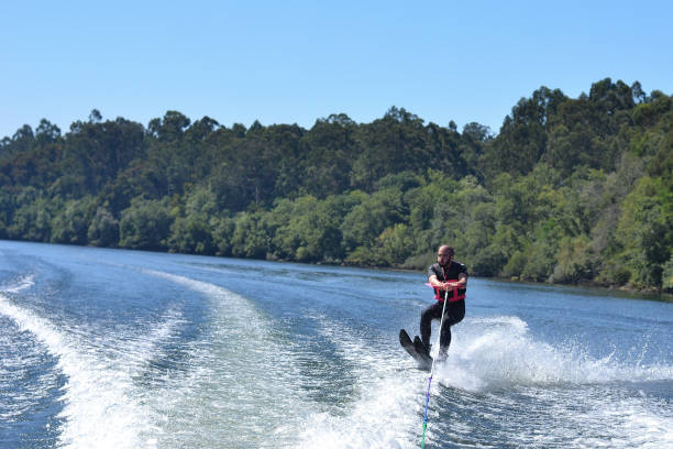 istock Young man waterskiing over the Minho river 1179626940