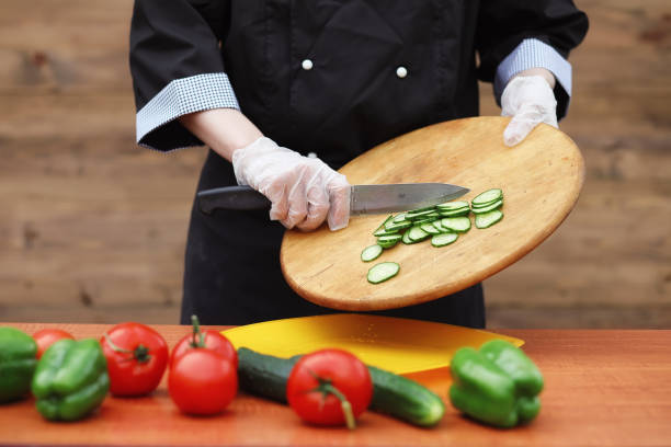 istock The cook cuts fresh farm vegetables 1179627136