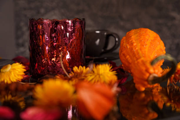 istock Beautiful vintage decorative composition with a vase and a pumpkin on a table, surrounded by dried flowers. 1179627504