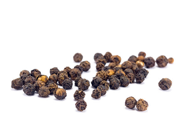 black pepper black pepper grains isolated on white background black peppercorn photos stock pictures, royalty-free photos & images