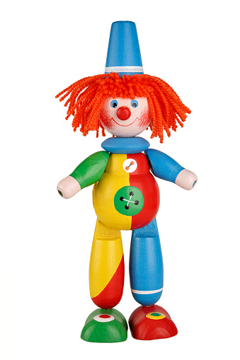children's toy circus clown isolated on white background, circus performance concept