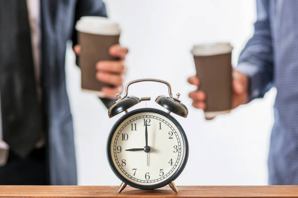 istock Two men drinking coffee in paper take away cup. Concept of coffee break at work 1179630670