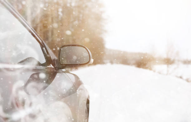 istock Car on a snowy winter road in fields. 1179632249
