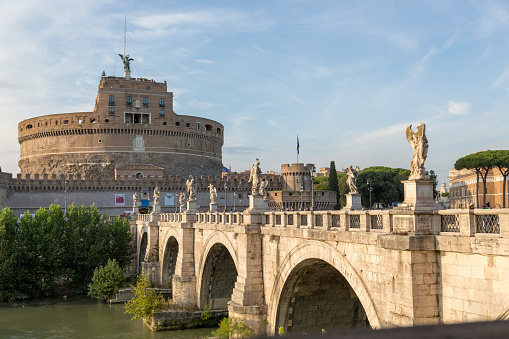 Rome, Italy - August 16, 2019: Castle of the Holy Angel and the bridge - architectural monuments on the banks of the Tiber in the center of Rome