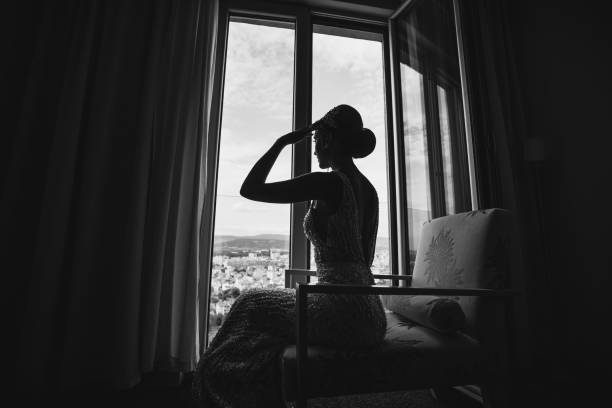 Beautiful young bride posing in hotel apartment on wedding day
