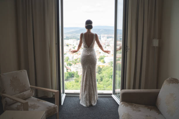 istock Beautiful young bride posing in hotel apartment on wedding day 1179634940