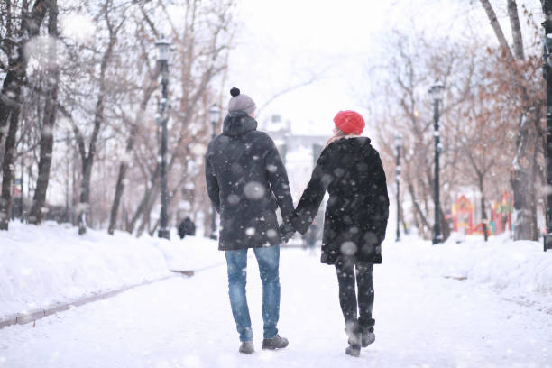 istock Young couple walking through the winter 1179635081