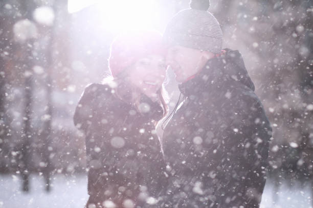 istock Young couple walking through the winter 1179635108