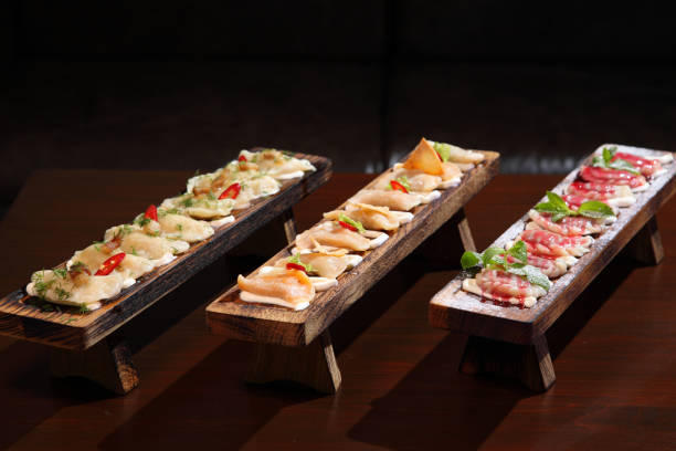 istock Dumplings with potato on a wooden board.  Dumplings with mushrooms. Dumplings with cherries. 1179637607