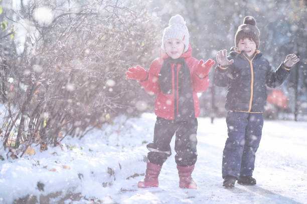 istock Kids walk in the park first snow 1179638928