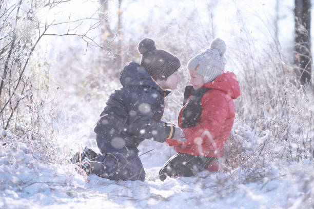 istock Kids walk in the park first snow 1179639136