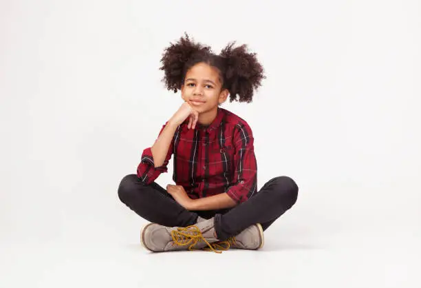 Photo of Cute teenage girl in casual stylish clothes sitting