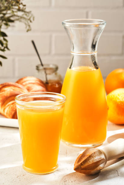 istock Fresh Squeezed Orange Juice with Fresh Fruits. 1179639471