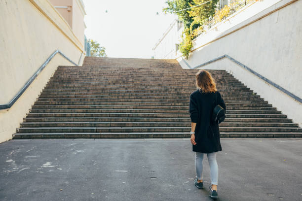 istock Woman with curly hair walks 1179640432