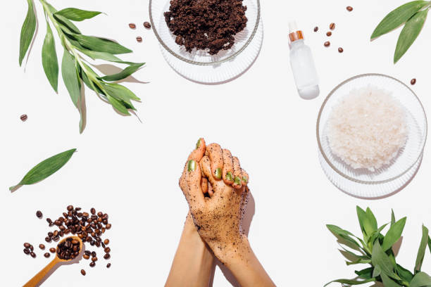 istock Top view woman's hands apply homemade coffee scrub 1179640496