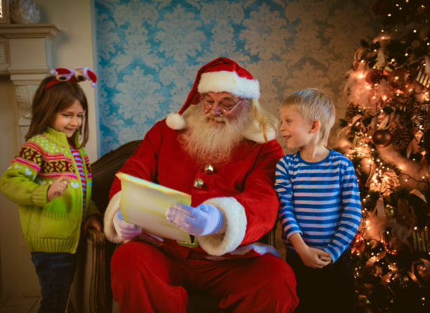 istock Santa Claus gives presents 1179641152