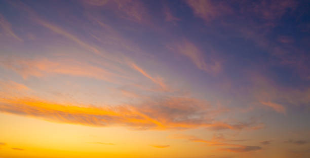 istock Sunset sky in orange and blue with clouds 1179642225