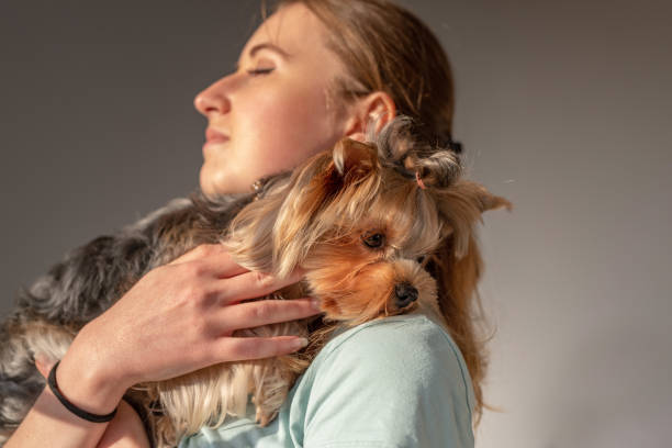 istock Woman hugging the yorkshire terrier 1179643852